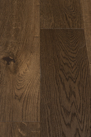 A picture showing Denver hardwood from the Wildwood Nature collection. The photo shows some minor variation from board to board. The hardwood is a dark brown smoked oak with a wire-brushed surface.