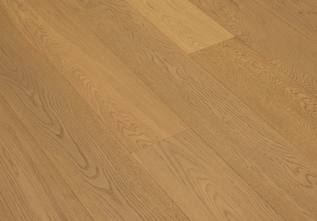 A picture of Naples hardwood from the Wildwood Nature collection. The hardwood is a light beige-caramel colour and there are little to no knots or minor variations in the hardwood, due to the high grade of wood.