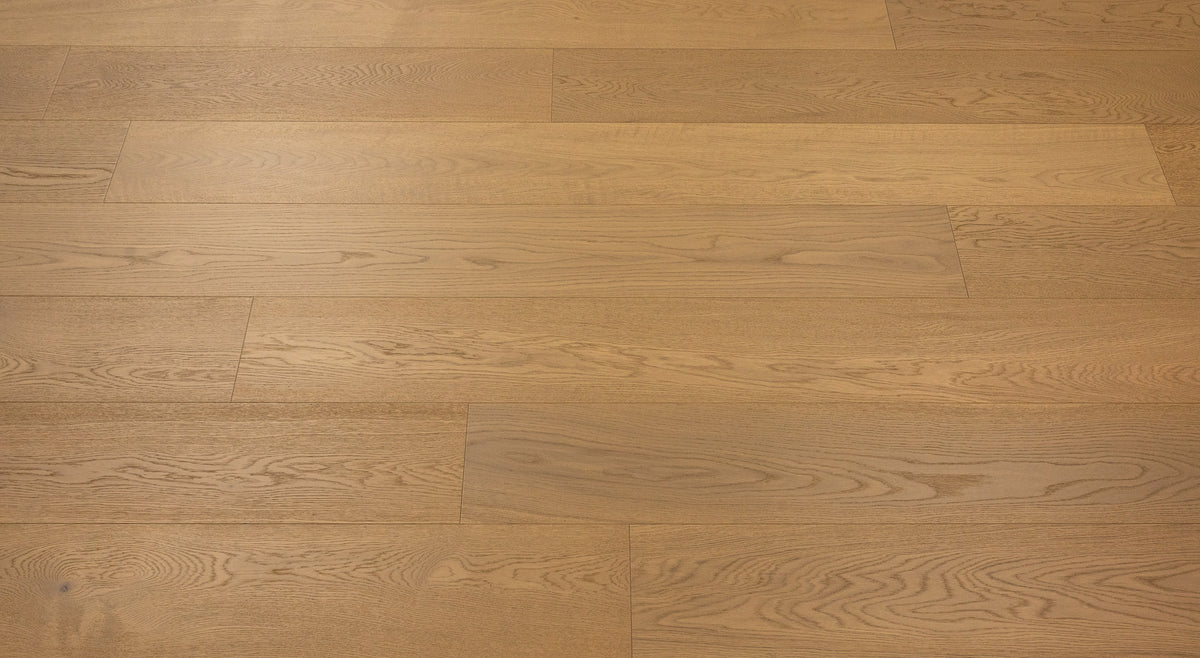 A picture of Naples hardwood from the Wildwood Nature collection. The hardwood is a light beige-caramel colour and there are little to no knots or minor variations in the hardwood, due to the high grade of wood.