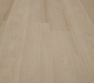 A picture showing the 6.5mm lvp flooring called Pompeii. It has a light medium beige hue and silver chain embossing, giving the floor an ultra-realistic look.