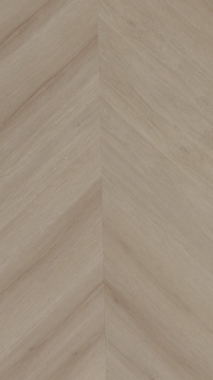 A picture showing the 6.5mm lvp flooring called Pompeii in the chevron pattern. This vinyl floor is uniquely crafted and can only be installed in the chevron pattern. It has a light medium beige hue and silver chain embossing, giving the floor an ultra-realistic look.