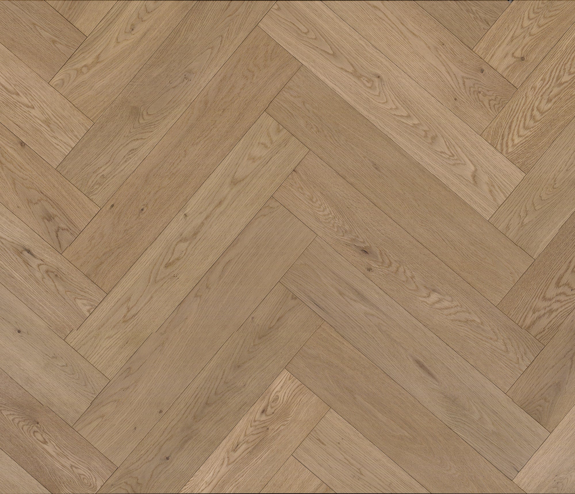 A picture of Verona herringbone hardwood shown from a top-down view. The hardwood is a very light beige-caramel colour and features very small knots and minor variation form board to board.