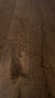 A picture of the oak  hardwood flooring called Vienna from the Wildwood Antique Collection, showing some knots and variation with a dark brown stain.