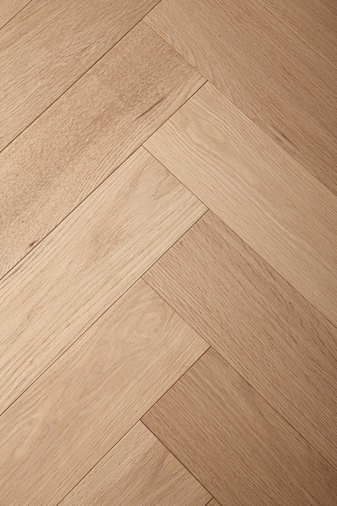 A picture of Arvand herringbone hardwood, showing minimal variation and the clean look of this hardwood.