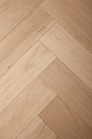 A picture of Arvand herringbone hardwood, showing minimal variation and the clean look of this hardwood.