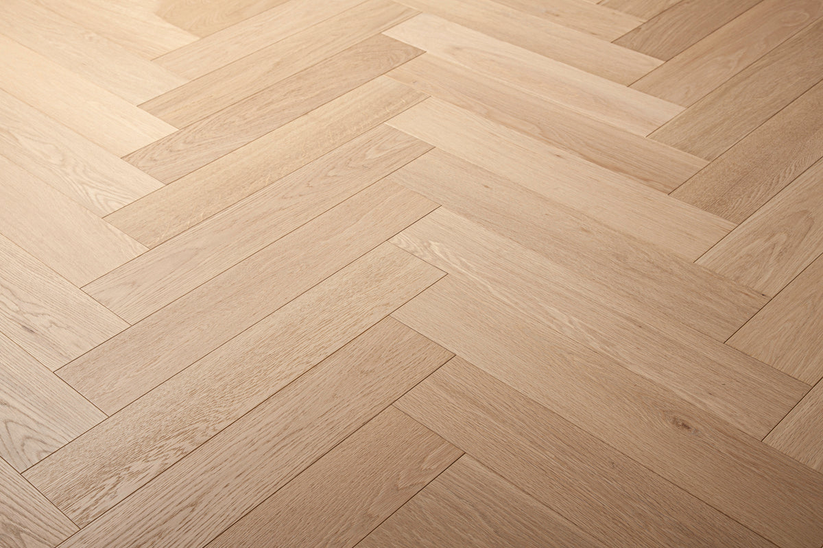 A picture of Arvand herringbone hardwood, showing minimal variation and the clean look of this hardwood.