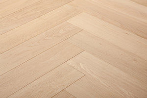 A picture of Arvand herringbone hardwood, showing minimal variation and the clean look of this hardwood.