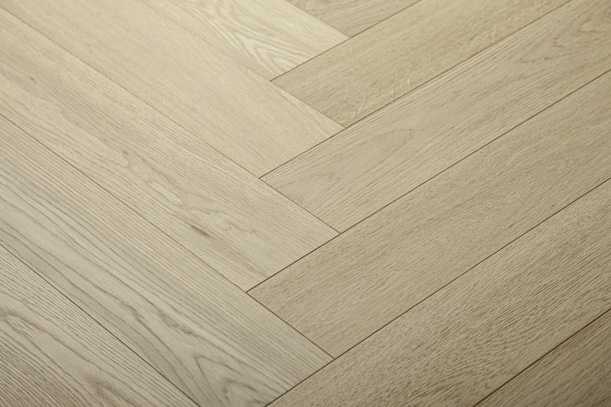A picture of Arvand herringbone hardwood, showing minimal variation and the clean look of this hardwood.