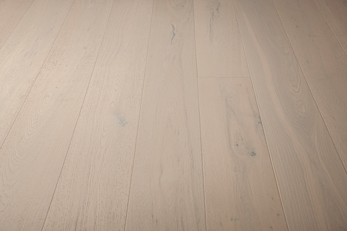 A picture of the oak  hardwood flooring called Florence from the Wildwood Antique Collection, showing some minor knots and variation with a light, white-washed hue.