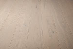 A picture of the oak  hardwood flooring called Florence from the Wildwood Antique Collection, showing some minor knots and variation with a light, white-washed hue.