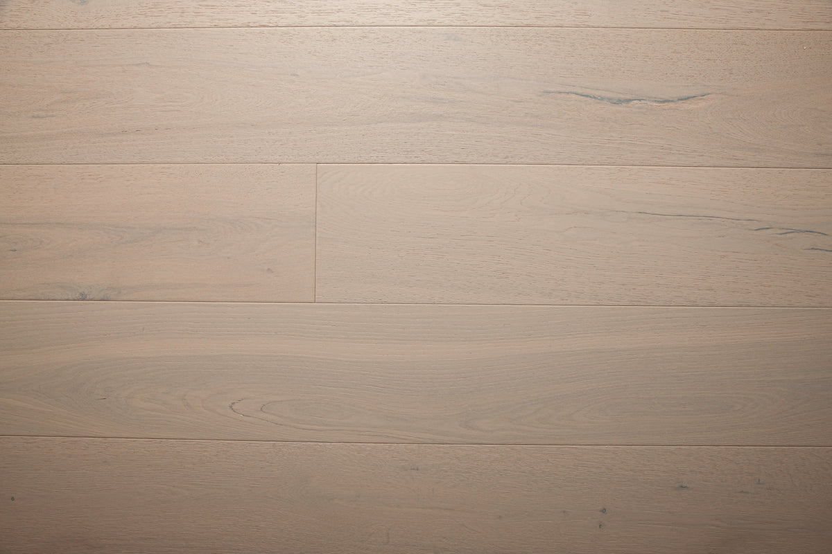 A picture of the oak  hardwood flooring called Florence from the Wildwood Antique Collection, showing some minor knots and variation with a light, white-washed hue.