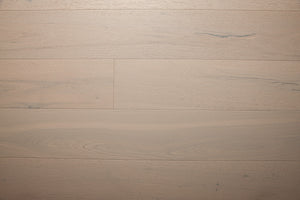 A picture of the oak  hardwood flooring called Florence from the Wildwood Antique Collection, showing some minor knots and variation with a light, white-washed hue.