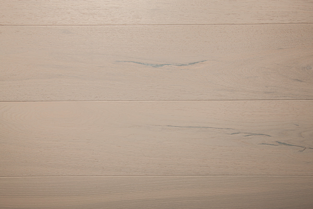 A picture of the oak  hardwood flooring called Florence from the Wildwood Antique Collection, showing some minor knots and variation with a light, white-washed hue.