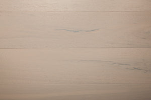 A picture of the oak  hardwood flooring called Florence from the Wildwood Antique Collection, showing some minor knots and variation with a light, white-washed hue.