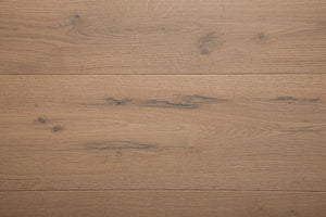 A picture of the oak  hardwood flooring called Istanbul from the Wildwood Antique Collection, showing some knots and variation with a grey and beige tones.