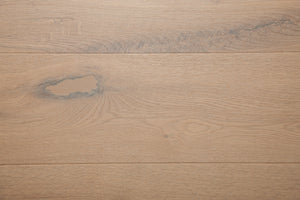 A picture of the oak  hardwood flooring called Istanbul from the Wildwood Antique Collection, showing some knots and variation with a grey and beige tones.