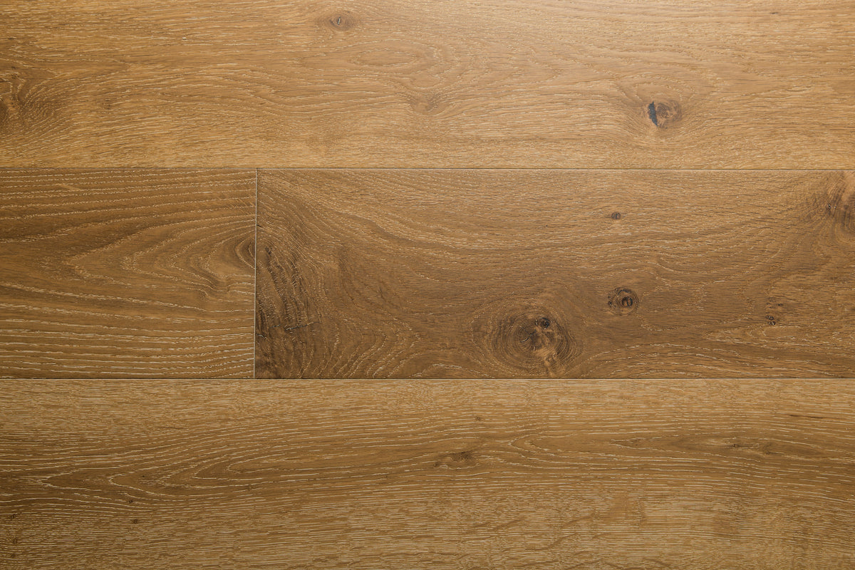 A photo showing the hardwood called Kurang from the Wildwood Nature Collection. The hardwood is an amber colour with a very light white washing that accentuates the wood grain. There is some variation and knots.