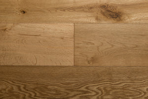 A picture of the oak  hardwood flooring called Oak Natural from the Wildwood Antique Collection, showing some knots and variation with a light amber tone.