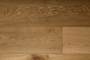 A picture of the oak  hardwood flooring called Oak Natural from the Wildwood Antique Collection, showing some knots and variation with a light amber tone.