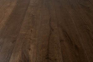 A picture of the oak  hardwood flooring called Vienna from the Wildwood Antique Collection, showing some knots and variation with a dark brown stain.