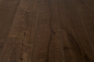 A picture of the oak  hardwood flooring called Vienna from the Wildwood Antique Collection, showing some knots and variation with a dark brown stain.