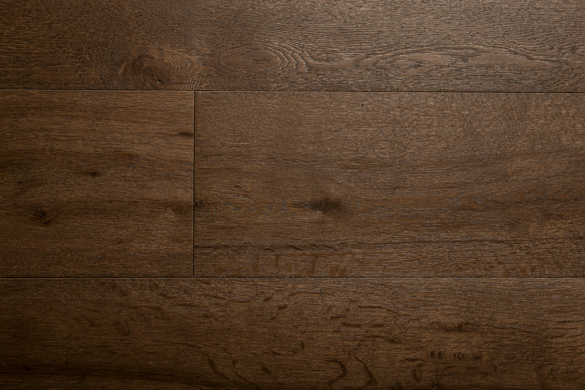 A picture of the oak  hardwood flooring called Vienna from the Wildwood Antique Collection, showing some knots and variation with a dark brown stain.