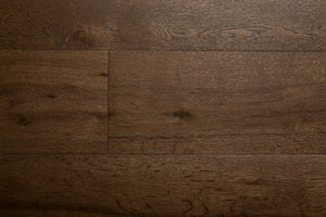 A picture of the oak  hardwood flooring called Vienna from the Wildwood Antique Collection, showing some knots and variation with a dark brown stain.