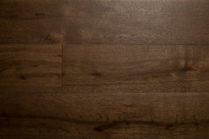 A picture of the oak  hardwood flooring called Vienna from the Wildwood Antique Collection, showing some knots and variation with a dark brown stain.